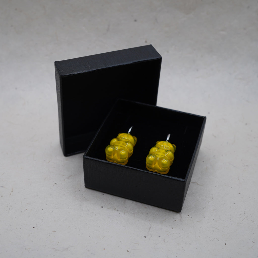 Yellow gummy bear skeleton earrings presented in black gift box, transparent resin handmade jewelry ready for gifting