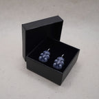 Dark transparent gummy bear skeleton earrings displayed in black gift box, glossy resin gothic handmade jewelry
