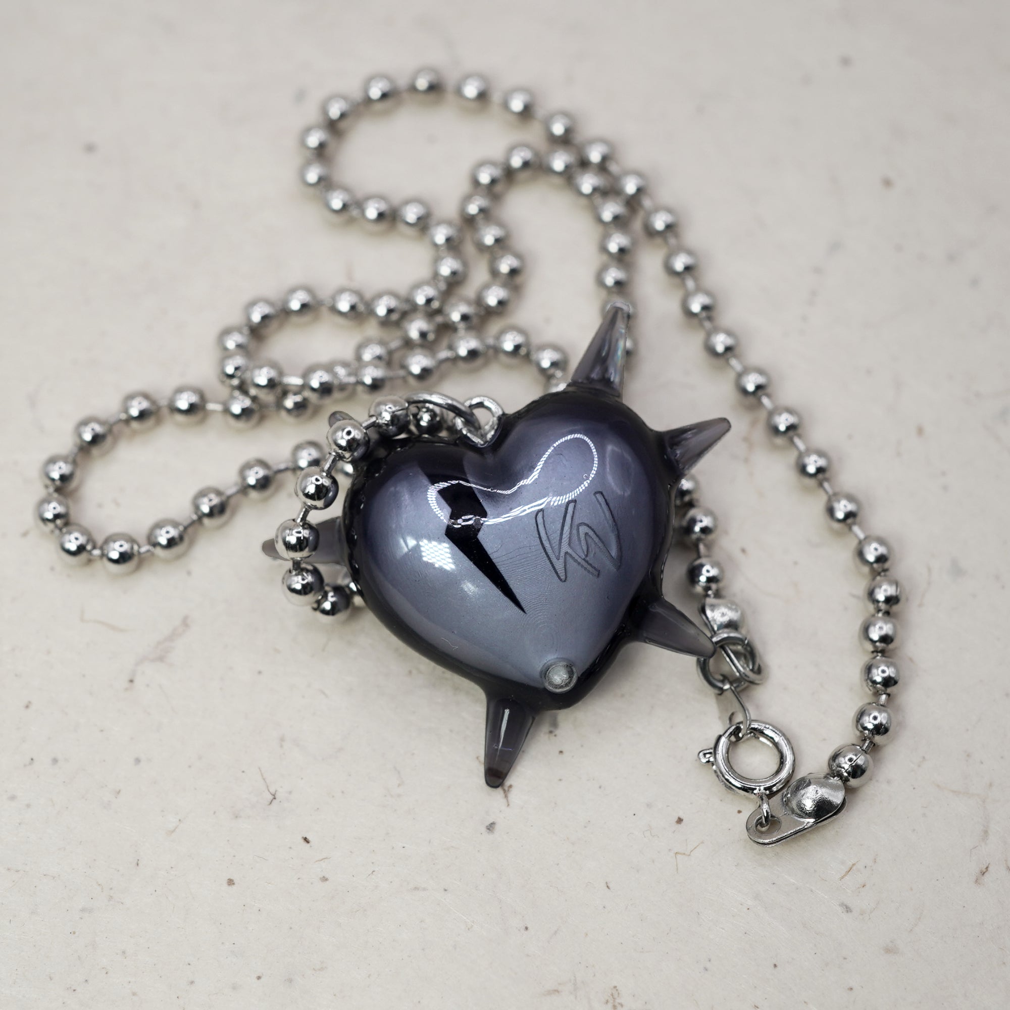 Spiked heart pendant on rhodium plated ball chain, modern goth statement necklace, glossy black resin heart with spikes and crack