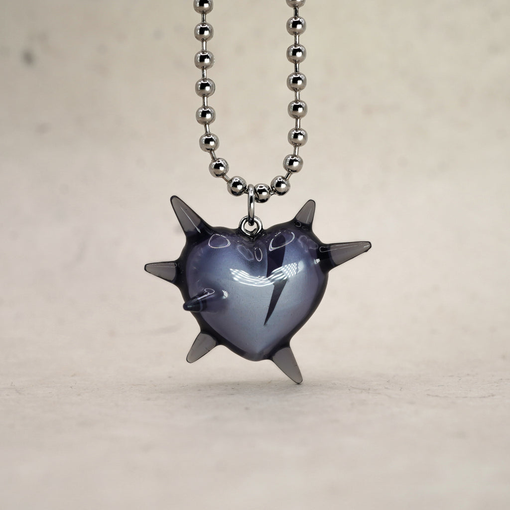 Spiked heart pendant necklace in transparent black resin, broken heart detail, rhodium plated ball chain, alternative luxury jewelry