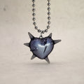 Spiked heart pendant necklace in transparent black resin, broken heart detail, rhodium plated ball chain, alternative luxury jewelry