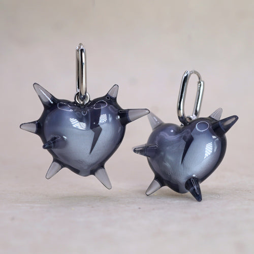 Pair of dark translucent spiked heart earrings in glossy resin, gothic handmade jewelry with sharp heart design