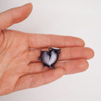 Pair of spiked heart resin earrings with visible cracked heart detail, alternative gothic jewelry aesthetic